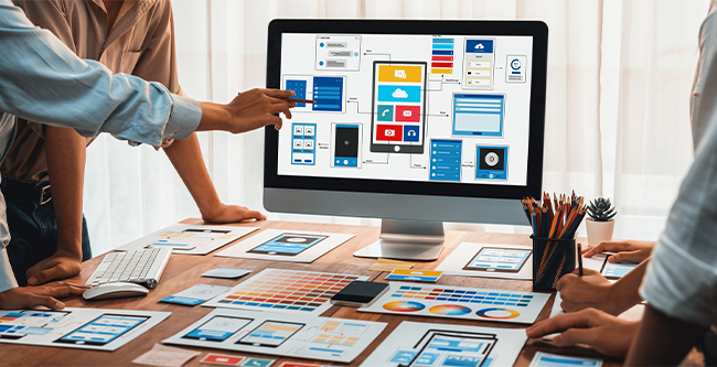 Team of developers in a web design for small businesses agency working on a client's site.